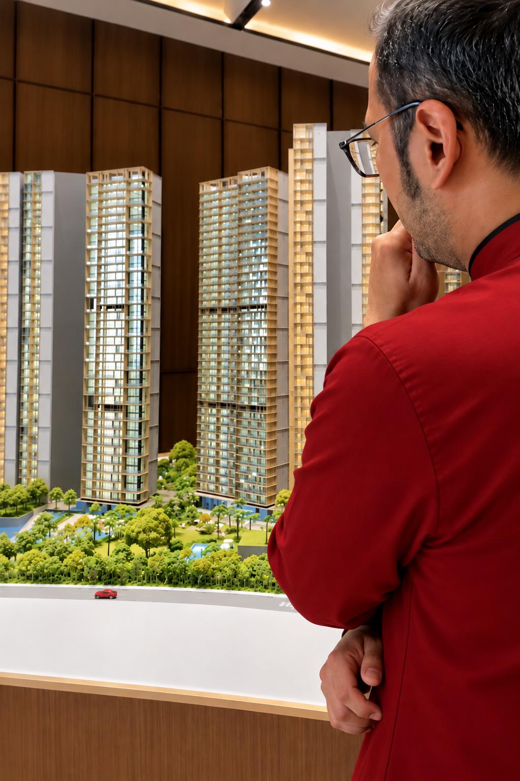 Consultant examining an architectural model